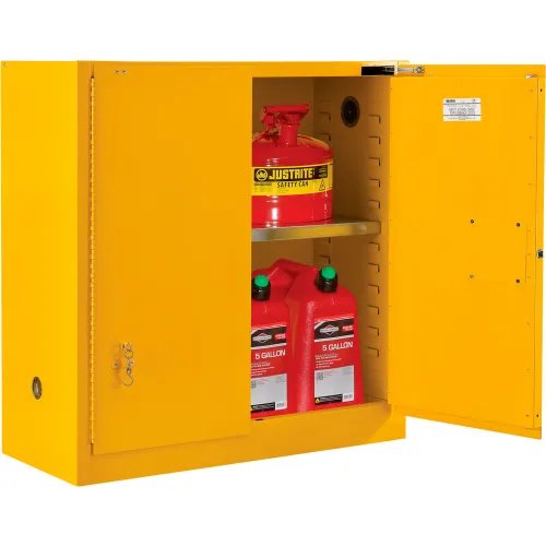 Global Industrial 30 gallon yellow flammable cabinet with one door open, showing red safety cans on an adjustable steel shelf